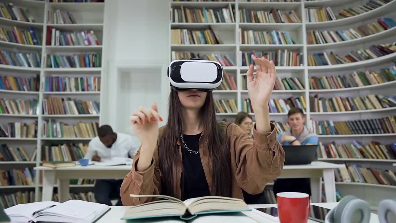 Girl using VR in class books