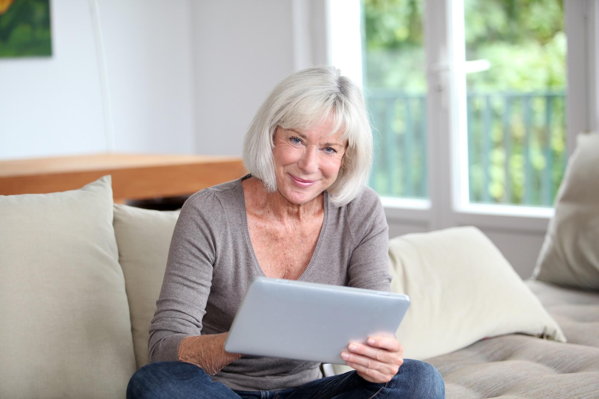 Brain training for seniors - older woman using tablet